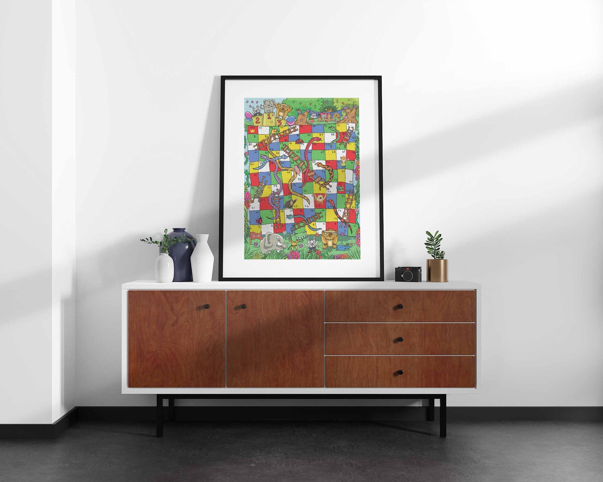 Colorful jungle-themed Snakes and Ladders board illustrated on a 1000-piece jigsaw puzzle
